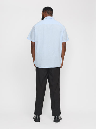 Chemise manches courtes bleue en mélange de lin