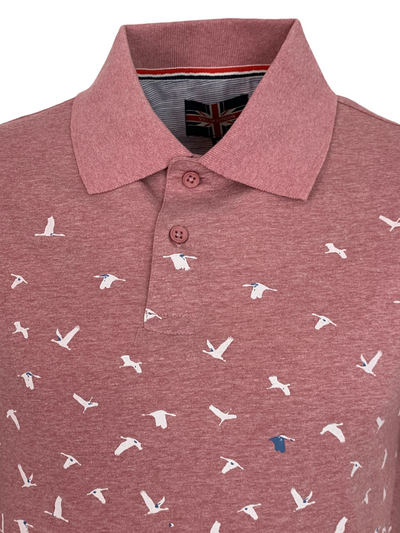 Polo rose à motif d'oiseaux